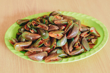 A seafood dish made from clams with sweet and sour sauce, menu in a seafood restaurant.