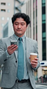 Walking, businessman and coffee with phone in city, travel journey and location application for commute. Japanese, male person and employee with mobile for digital guide, online map and tea in Tokyo