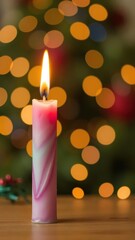 Colorful candle glowing with festive bokeh lights in the background, party, celebration, cheerful