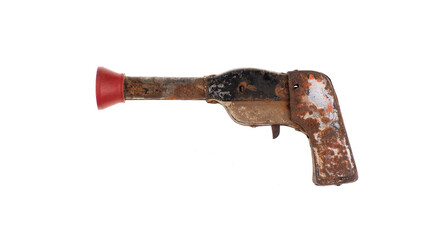 old rusty iron toy gun isolated on white background