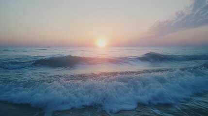 Fototapeta premium Serene sunrise over calm ocean waves.