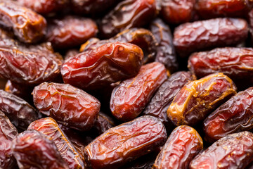 Dried raw organic medjool date fruits in a group