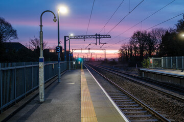 Serene Early Morning Train Platform at Sunrise