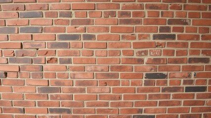 Obraz premium Weathered red brick wall with rough texture and cracks, antique, worn