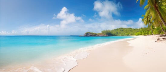 Serene beach landscape with white sand and clear water featuring footprints in the foreground perfect for relaxation and escape from daily life