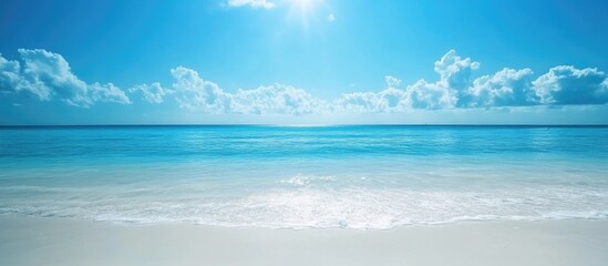 Tranquil tropical beach scene with crystal clear water blue sky and soft white sand ideal for vacation and relaxation imagery