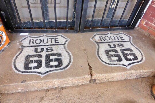 The Sandhills Curiosity Shop. Black and White Route 66 signs painted on the doorstep. Erick, OK, USA. June 7, 2014. 