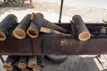 bamboo tubes as containers for roasting chicken