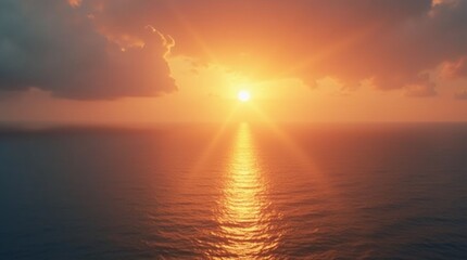Obraz premium sunrise over a calm ocean, symbolizing a new beginning. The warm colors of the sky reflect on the water, creating a serene atmosphere that evokes feelings of hope and renewal