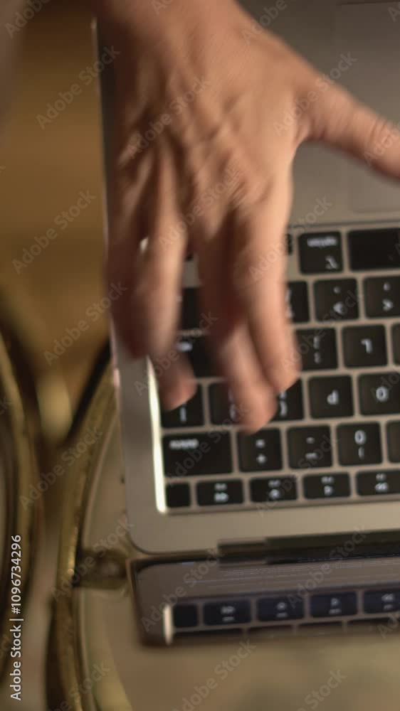 Poster This image captures a closeup view of hands actively typing on a laptop while a cup of coffee rests nearby, set against a cozy and ambient environment that promotes productivity and creativity
