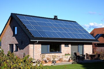 Fototapeta premium A residential house with solar panels installed on the rooftop, a sustainable energy solution