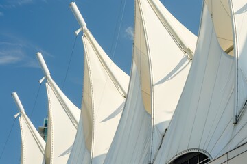 A large white building with a clock tower, suitable for use in architecture or cityscape scenes