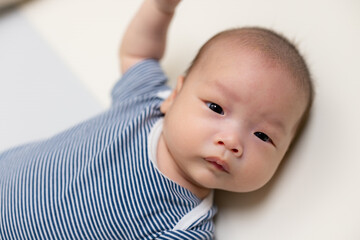 Adorable Newborn Baby Sleeping on a Mat