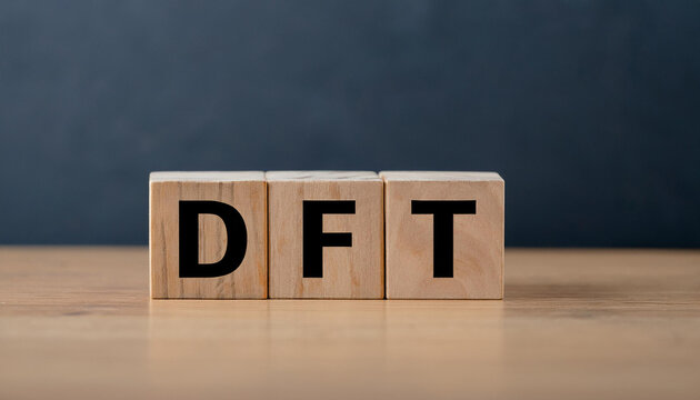 Wooden cubes with abbreviation DFT on table. Digital Film Transfer. Demand Flow Technology.