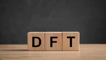 Wooden cubes with abbreviation DFT on table. Digital Film Transfer. Demand Flow Technology.
