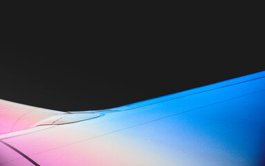 Airplane wing, abstract shape and geometry against the night sky