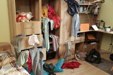Scattered Things in Wardrobe, Disorder in Clothes. Childrens room is littered with clutter, clothes and things are scattered, Organizing Cleanliness