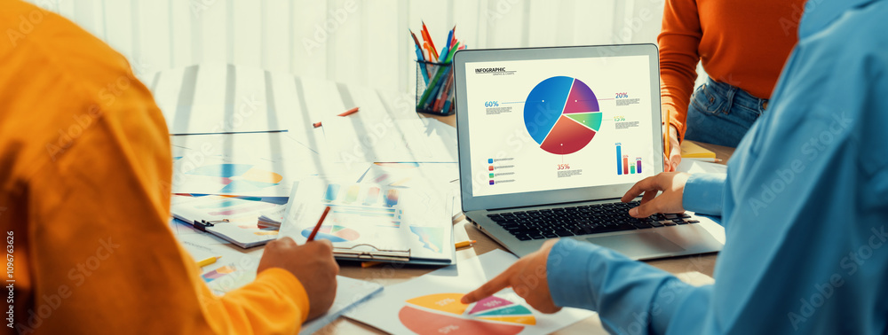 Poster startup company employee working together using laptop analyzing bi dashboard paper on financial dat