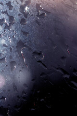 Close Up of Rain Drop Bubble Water on Glass Metal Background with Condensation