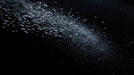 Obraz premium Fish in the ocean. A large school of fish swim in circles in the ocean 