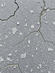 Obraz premium Rough and weathered grey stone surface with intricate patterns and textures, rocky