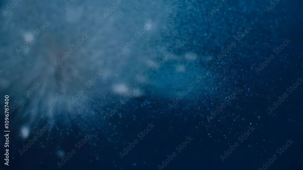 Poster a mesmerizing display unfolds as tiny particles gather at the center before bursting outward in a so