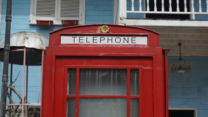 Red Telephone Box in City Park