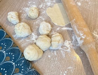 Dough on the table and flour and rolling pin kitchen photo 