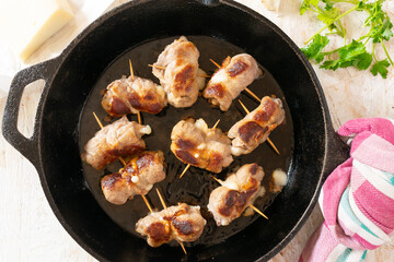 Traditional Italian meat rolls stuffed with cheese and herbs, called Bombette Pugliesi.