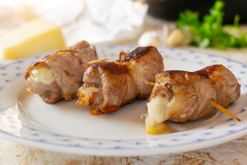 Traditional Italian meat rolls stuffed with cheese and herbs, called Bombette Pugliesi.