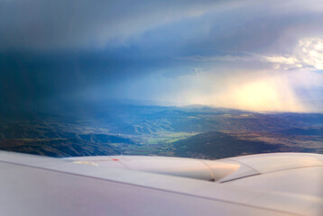 rain cloud and flying airplain