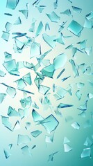 Fototapeta premium Scattered shards of blue-tinted glass, creating a dynamic visual display against a soft gradient background.