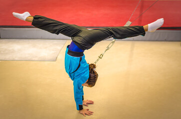 Young gymnast girl practicing handstand
