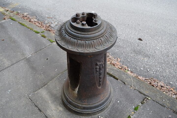 Cast iron base of old street light