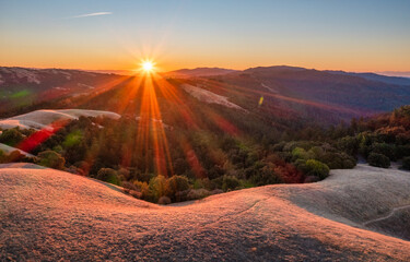An awe inspiring aerial view of a lush mountain landscape at sunrise, captured  in stunning 4K quality. The serene valleys and towering peaks create a cinematic natural video scene of Silicon Valley