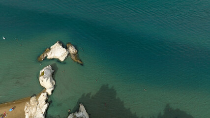 Obraz premium Aerial view of stacks in the crystal blue sea. Rocky coast.