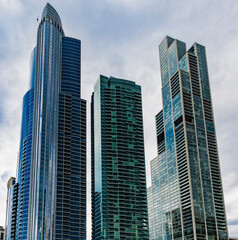 Glass skyscraper. City architecture. Architecture of modern office building. Perspective city skyscraper. Business skyscraper building. Architectural building in business area. Modern city