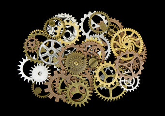 Heap of different steampunk gears isolated on black background.	