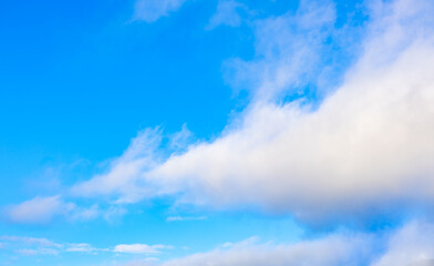 Beautiful blue sky and white fluffy group of clouds background in the morning skyline