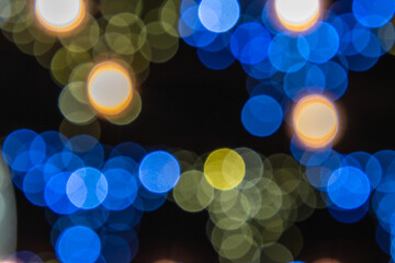 Abstract colorful Bokeh lights background. Beautiful, vibrant blurry colored lights dot pattern