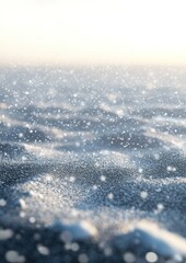 Snow-covered surface with glistening details and falling snowflakes