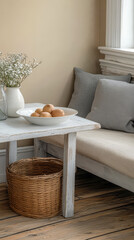 Neutral decor featuring a wooden table with fruit and flowers in a cozy corner of a home