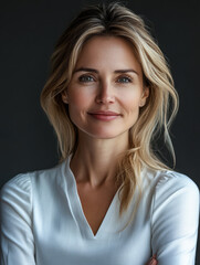 Obraz premium Elegant portrait of a confident woman with blonde hair in a minimalist setting