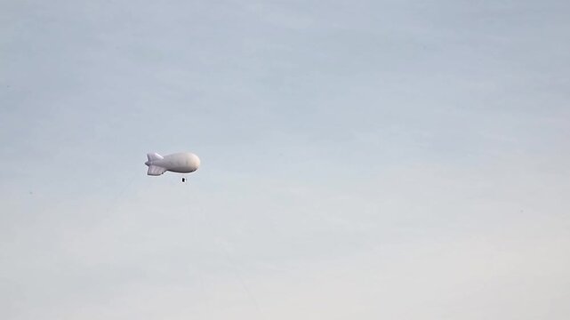 balloon for measuring weather conditions on the background sky