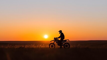 Biker Silhouette Against Sunset Horizon
