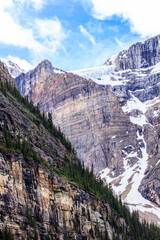 The mountain range is covered in snow and has a rocky terrain