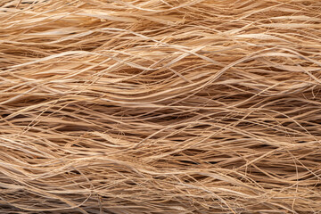 Close up straw texture background. raw flax fiber.
