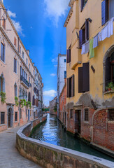 Typical picturesque canal in Venice, Italy.
