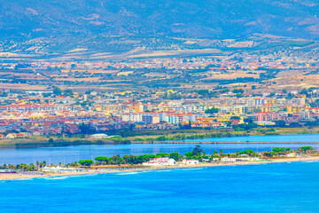 Poetto Beach in Cagliari stretch of sandy coastline offering clear blue waters and a scenic view of...
