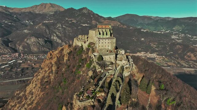 Aerial view of the Sacra di San Michele, an imposing abbey that dominates the entrance to the Susa Valley from the top of Mount Pirchiriano. Italy